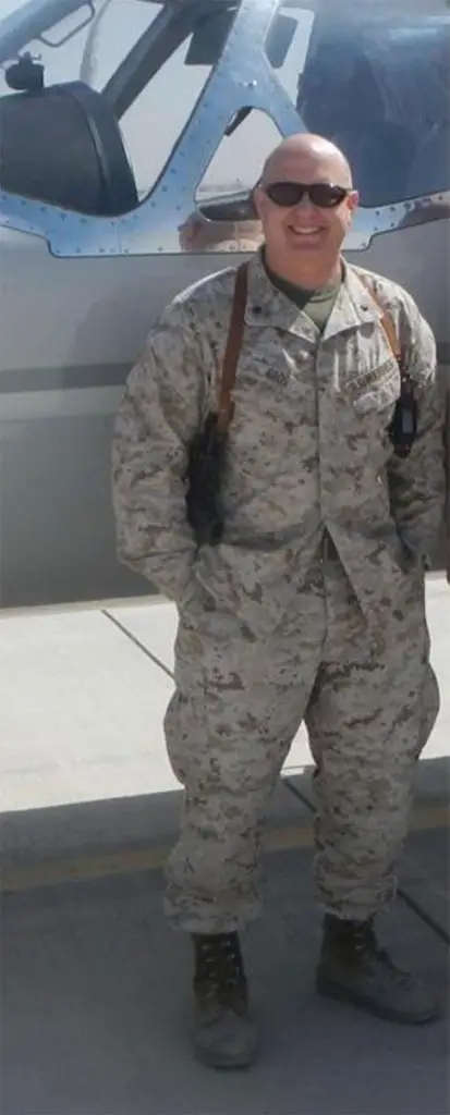 Chris Gros standing in front of an airplane